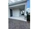 A welcoming front porch with stone pillars adds character to this home's facade at 3084 Ella Way, St Cloud, FL 34771