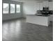 Bright open kitchen featuring white cabinetry, black backsplash, and an island at 3084 Ella Way, St Cloud, FL 34771