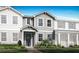Charming new construction home with a classic design, inviting entrance, and lush landscaping at 3173 Douglas Fir Dr, Apopka, FL 32703