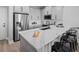 Bright kitchen with quartz countertops, stainless steel appliances, and a breakfast bar with seating at 3173 Douglas Fir Dr, Apopka, FL 32703