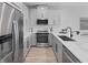 Well-equipped kitchen featuring stainless steel appliances, modern cabinets, and a sleek design at 3173 Douglas Fir Dr, Apopka, FL 32703