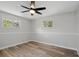 Comfortable bedroom with ceiling fan, natural light, and modern flooring at 326 Evergreen Ct, Apopka, FL 32712
