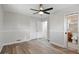 Inviting bedroom with fan, closet, and ensuite bathroom access at 326 Evergreen Ct, Apopka, FL 32712