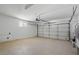 Spacious garage with an insulated door, epoxy floor and plenty of room for parking and storage at 326 Evergreen Ct, Apopka, FL 32712