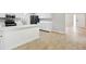 Bright kitchen featuring white cabinets, stainless steel appliances, and a large island at 326 Evergreen Ct, Apopka, FL 32712