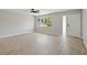 Inviting living room with tile floors, large window, and plenty of natural light at 326 Evergreen Ct, Apopka, FL 32712