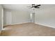 Bright living room with tile floors, neutral paint, and a modern ceiling fan at 326 Evergreen Ct, Apopka, FL 32712