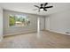 Open-concept living room boasts tile floors, a ceiling fan, and great natural light at 326 Evergreen Ct, Apopka, FL 32712