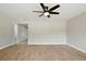 Spacious living area with tile floors and a modern ceiling fan at 326 Evergreen Ct, Apopka, FL 32712