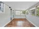 Bright sunroom filled with windows offering lots of natural light and pleasant views at 326 Evergreen Ct, Apopka, FL 32712