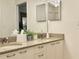 Bathroom featuring double sinks and granite countertops at 32900 Crooked Oaks Ln, Leesburg, FL 34748