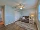 Bedroom with chair, lamp, and closet at 32900 Crooked Oaks Ln, Leesburg, FL 34748
