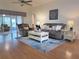 Cozy living room with comfortable furniture, area rug, and ceiling fan at 32900 Crooked Oaks Ln, Leesburg, FL 34748