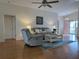 Bright living room with wood flooring and a stylish coffee table at 32900 Crooked Oaks Ln, Leesburg, FL 34748
