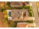 Overhead view of a home with a large pool, outdoor living space, and meticulously landscaped yard at 3647 Farm Bell Pl, Lake Mary, FL 32746