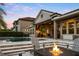 An outdoor oasis with a sparkling pool, a fire pit, and a covered patio with a built-in kitchen at 3647 Farm Bell Pl, Lake Mary, FL 32746