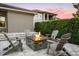 An inviting backyard area with a cozy fire pit and Adirondack chairs for relaxation and enjoyment at 3647 Farm Bell Pl, Lake Mary, FL 32746