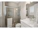 Modern bathroom featuring walk-in shower and white quartz countertop at 3647 Farm Bell Pl, Lake Mary, FL 32746