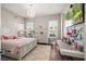 Bedroom featuring a chandelier, multiple windows, and desk at 3647 Farm Bell Pl, Lake Mary, FL 32746