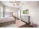 Bedroom featuring a large window, dresser, and ceiling fan at 3647 Farm Bell Pl, Lake Mary, FL 32746