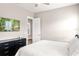 Serene bedroom featuring sleek furniture and a mounted television at 3647 Farm Bell Pl, Lake Mary, FL 32746