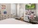 Bedroom featuring a large window, desk, and dresser, providing ample storage space at 3647 Farm Bell Pl, Lake Mary, FL 32746