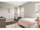 Bedroom featuring a large window, dresser, and ensuite bathroom at 3647 Farm Bell Pl, Lake Mary, FL 32746