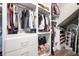 Walk-in closet with custom shelving, drawers, and mirror, providing ample storage space at 3647 Farm Bell Pl, Lake Mary, FL 32746