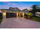 Home with three-car garage, brick paver driveway, and inviting courtyard entrance, set amidst lush landscape at 3647 Farm Bell Pl, Lake Mary, FL 32746