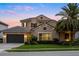 Beautiful two-story home with a tile roof, well-maintained landscaping, and an attached two-car garage at 3647 Farm Bell Pl, Lake Mary, FL 32746