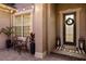 Charming front entrance with decorative glass door, stylish wreath, elegant lanterns and a welcoming 'hello' doormat at 3647 Farm Bell Pl, Lake Mary, FL 32746