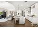 Bright, open kitchen with island, stainless steel appliances, and view to the living room at 3647 Farm Bell Pl, Lake Mary, FL 32746