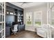 Home office with custom built-ins, shelving and natural light at 3647 Farm Bell Pl, Lake Mary, FL 32746