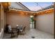 Serene patio with brick pavers, stylish seating, and string lights creates an inviting outdoor living space at 3647 Farm Bell Pl, Lake Mary, FL 32746
