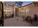 Cozy outdoor patio featuring brick pavers, string lights, and comfortable seating under a twilight sky at 3647 Farm Bell Pl, Lake Mary, FL 32746