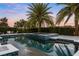 Inviting backyard pool with hot tub, seating area, and lush landscaping, ideal for outdoor living at 3647 Farm Bell Pl, Lake Mary, FL 32746