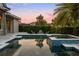 A gorgeous pool and patio area with lush landscaping and a tranquil fire pit setting at 3647 Farm Bell Pl, Lake Mary, FL 32746