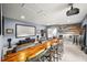 Spacious theater room features a large screen, projector, bar area, and custom seating for entertaining at 3647 Farm Bell Pl, Lake Mary, FL 32746
