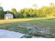 Overhead view of the backyard with shed, green grass, mature trees offering a private outdoor space at 3713 N Econlockhatchee Trl, Orlando, FL 32817
