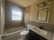 Modern bathroom with a tiled shower/tub combo, floating vanity, and decorative lighting at 3713 N Econlockhatchee Trl, Orlando, FL 32817
