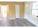 Welcoming entryway with wood-look floors and natural light, leads into adjacent living spaces at 3713 N Econlockhatchee Trl, Orlando, FL 32817