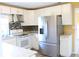 Modern kitchen boasts stainless steel appliances, ample cabinet space, and a stylish backsplash at 3713 N Econlockhatchee Trl, Orlando, FL 32817