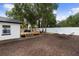 Relaxing backyard with a wooden deck and hammock, perfect for outdoor enjoyment at 376 Orange Ave, Longwood, FL 32750