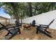 Cozy backyard with Adirondack chairs around a fire pit, perfect for evening gatherings at 376 Orange Ave, Longwood, FL 32750