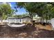 Spacious backyard with a deck, firepit, and hammock offers a relaxing outdoor retreat at 376 Orange Ave, Longwood, FL 32750
