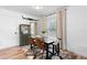 Bright dining area with modern decor, a sleek table setup, and ample natural light at 376 Orange Ave, Longwood, FL 32750
