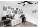Well-lit home office with dual monitors, a modern desk, and decorative wall art at 376 Orange Ave, Longwood, FL 32750
