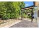 Open back patio with stone pavers and a view to the backyard landscaping and treeline at 428 Tarrson Blvd, Lady Lake, FL 32159