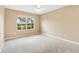 Bedroom with a carpeted floor, one window and a ceiling fan at 428 Tarrson Blvd, Lady Lake, FL 32159