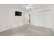 Bedroom with a flat screen television, closet and ceiling fan at 428 Tarrson Blvd, Lady Lake, FL 32159